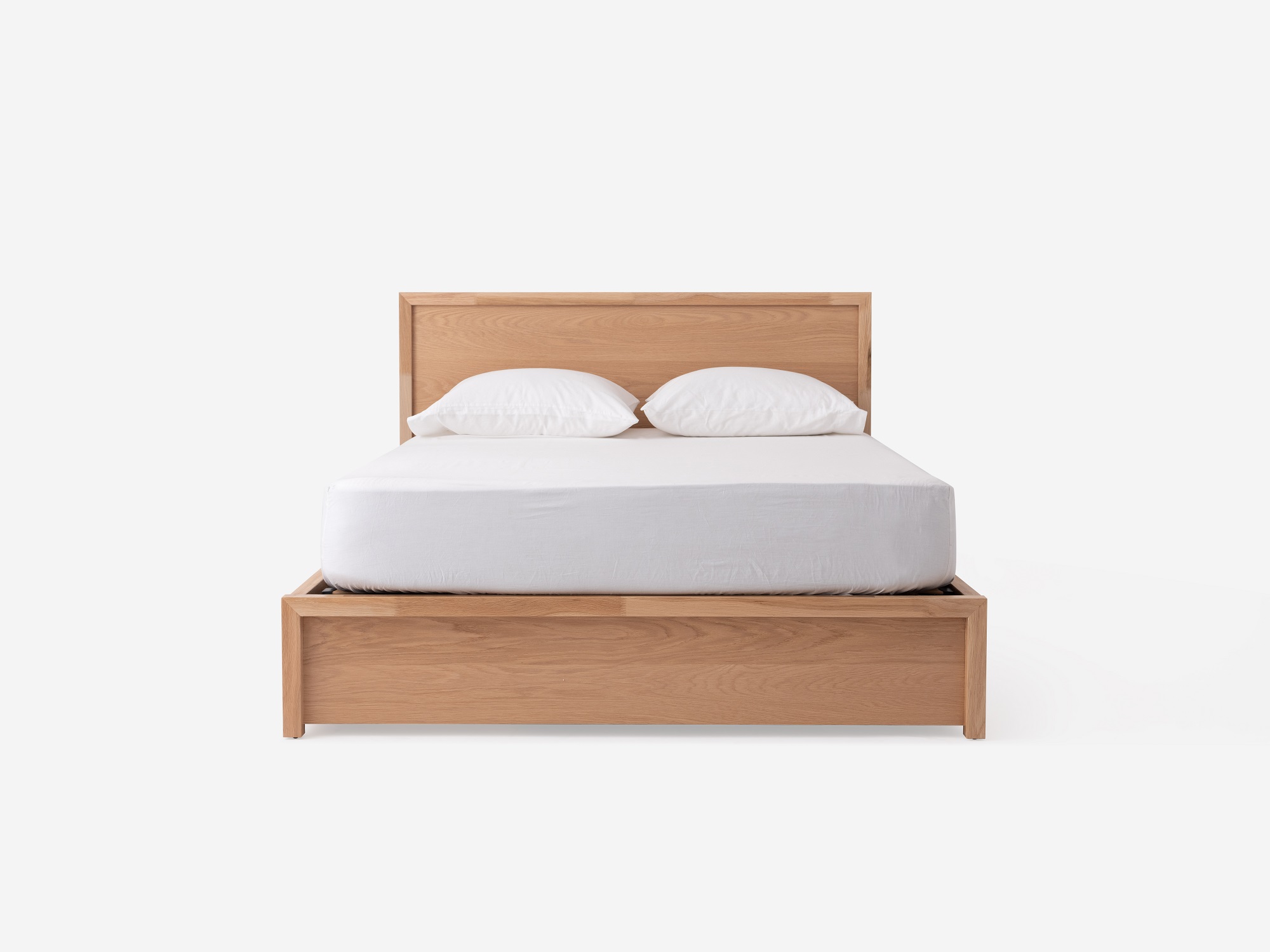 Front view of Marcel lift up storage bed in oak